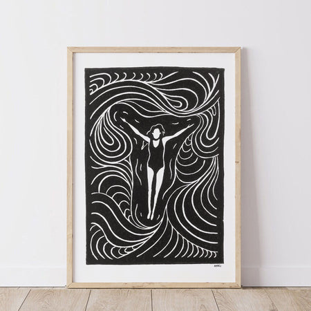 Framed black and white artwork of a woman with floating in the ocean with flowing lines of movement