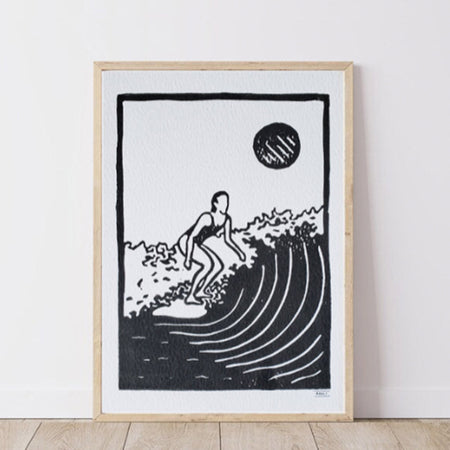 Framed artwork of a surfer on a wave with a minimalistic design.